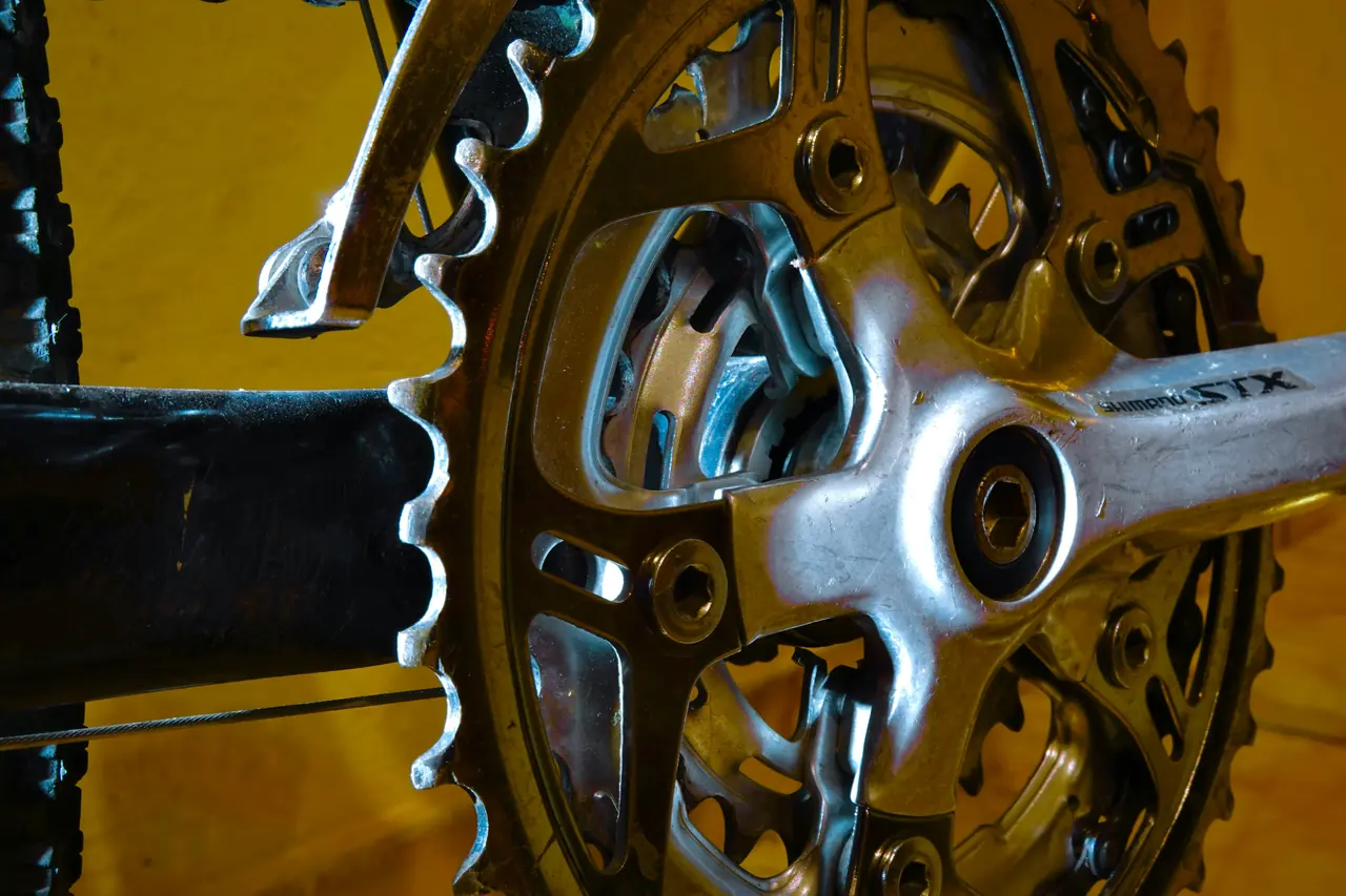 Crankset with several chainrings of different sizes and the front derailleur