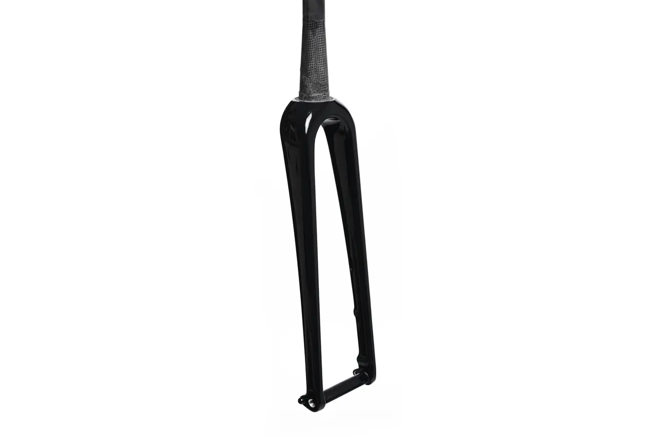Rigid black carbon fork with its steerer tube, on a white background