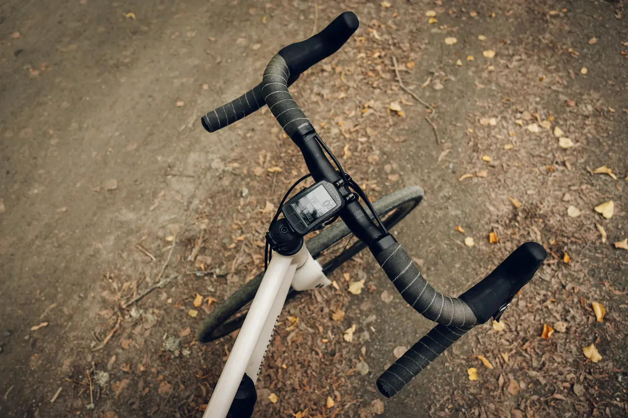 Drop handlebar with grey bar tape and a bike computer, seen from above